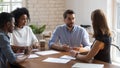 Concentrated employees listening to boss project instruction. Royalty Free Stock Photo