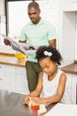 Concentrated father reading newspaper Royalty Free Stock Photo