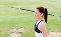 Concentrated female athlete ready to throw javelin Royalty Free Stock Photo