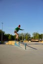 Concentrated female inline-skater practicing stunts and tricks on ramp Royalty Free Stock Photo