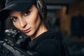 Concentrated female shooter aiming at a target Royalty Free Stock Photo