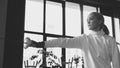 Young concentrated fencer woman training fencing exercise in studio indoors