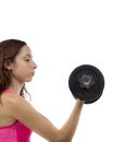 Concentrated fitness woman working out her biceps Royalty Free Stock Photo