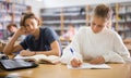 Concentrated fourteen-year-old schoolgirl writes a synopsis Royalty Free Stock Photo