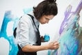 Concentrated girl focused on creative art-making process in art therapy Royalty Free Stock Photo