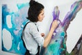 Concentrated girl focused on creative art-making process in art therapy Royalty Free Stock Photo