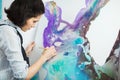 Concentrated girl focused on creative art-making process in art therapy Royalty Free Stock Photo