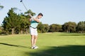 Concentrated golfer man taking shot Royalty Free Stock Photo