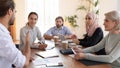 Concentrated group of diverse business partners discussing development strategy. Royalty Free Stock Photo