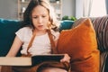 Concentrated kid girl reading interesting book at home Royalty Free Stock Photo
