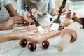 Concentrated lady and kid baking something tasty Royalty Free Stock Photo