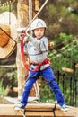 Concentrated little Boy on the rope track