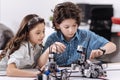 Concentrated little scientists enjoying tech lesson at school