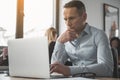 Concentrated male watching at laptop Royalty Free Stock Photo