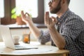 Concentrated male meditating in office relieving stress Royalty Free Stock Photo