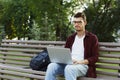Concentrated man working on his laptop outdoors Royalty Free Stock Photo