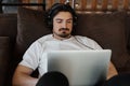 Concentrated Man with Laptop and Headphones Royalty Free Stock Photo