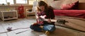 Concentrated man play on electric guitar on floor Royalty Free Stock Photo