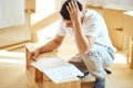 Concentrated man reading instructions to assemble furniture at home Royalty Free Stock Photo