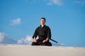 Man meditating before martial arts training Royalty Free Stock Photo