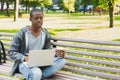 Concentrated man working on his laptop outdoors Royalty Free Stock Photo