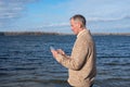 Concentrated man works with a digital tablet while walking Royalty Free Stock Photo