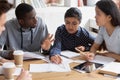 Focused diverse students discuss ideas studying in class together Royalty Free Stock Photo