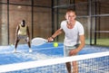 Concentrated paddle tennis player preparing to hit forehand Royalty Free Stock Photo