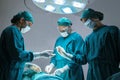 Concentrated professional surgical doctor team operating surgery a patient in the operating room at the hospital. healthcare and Royalty Free Stock Photo