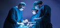 Concentrated professional surgical doctor team operating surgery a patient in the operating room at the hospital. healthcare and Royalty Free Stock Photo