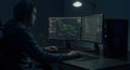 Hacker or Programmer Working on Multiple Screens in Dark Room Royalty Free Stock Photo