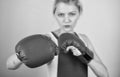 Concentrated on punch. Woman boxing gloves focused on attack. Ambitious girl fight boxing gloves. Female rights. I am