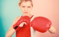 Concentrated on punch. Woman boxing gloves focused on attack. Ambitious girl fight boxing gloves. Female rights. I am