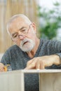 concentrated senior doing diy Royalty Free Stock Photo
