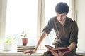 Concentrated serious young man read book Royalty Free Stock Photo