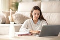 Concentrated student learning online at home Royalty Free Stock Photo