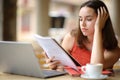 Concentrated student memorizing notes in a bar Royalty Free Stock Photo