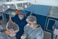 Concentrated Surgical team operating a patient in an operation theater Royalty Free Stock Photo