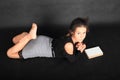 Concentrated teenage schoolgirl with book