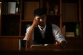 Thoughtful asian businessman focused reading some paragraph on the book