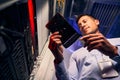 Concentrated tranquil data center worker examining HDD Royalty Free Stock Photo