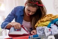 Concentrated woman ironing laundry Royalty Free Stock Photo