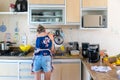 Concentrated woman is preparing proper meal in the kitchen