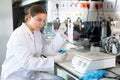 Shot of an young woman using equipment to work in a laboratory Royalty Free Stock Photo