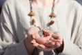 Concentrated woman wearing rosary beads. Close up Royalty Free Stock Photo