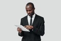 Concentrated young African man in formalwear Royalty Free Stock Photo