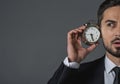 Concentrated young businessman with alarm clock Royalty Free Stock Photo