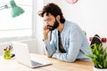 Concentrated young businessman working on laptop computer at home office Royalty Free Stock Photo