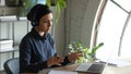 Concentrated young indian businesswoman holding video conference call with partners.