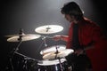 Concentrated young man playing drum set at concert Royalty Free Stock Photo